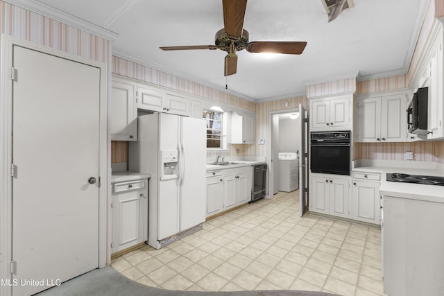 kitchen with white cabinetry, sink, ornamental molding, ceiling fan, and black appliances