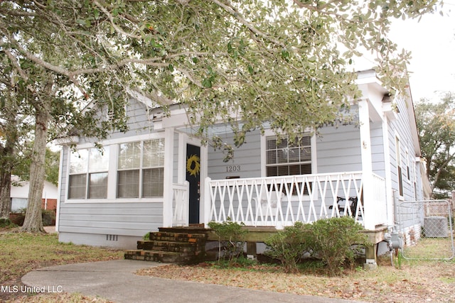 view of front of property featuring central AC and a porch