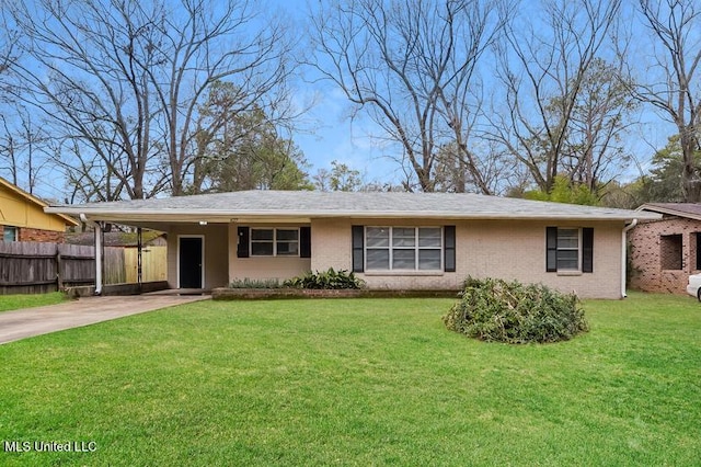 single story home with an attached carport, fence, a front yard, and driveway