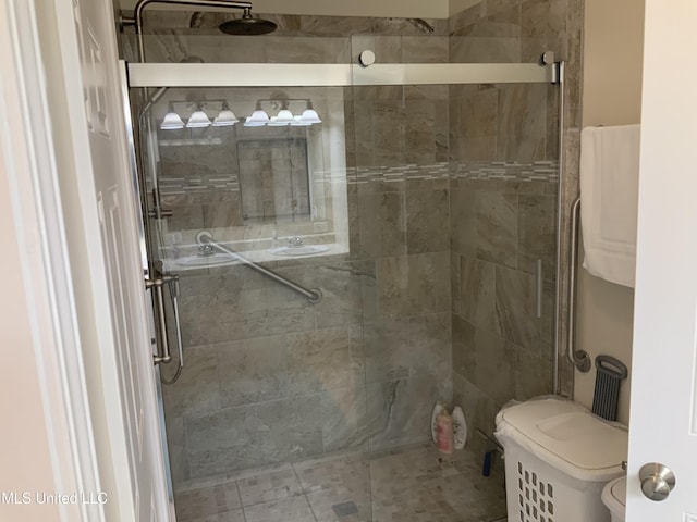 full bath with a shower stall and toilet