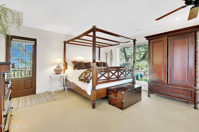 bedroom with light carpet and ceiling fan