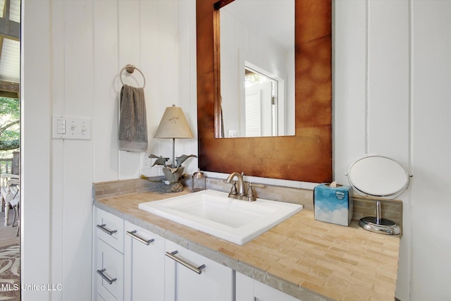 bathroom featuring hardwood / wood-style flooring and vanity