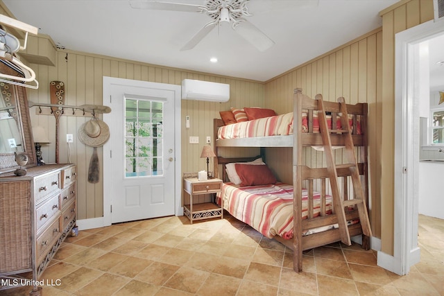 bedroom with wooden walls, ceiling fan, and a wall unit AC