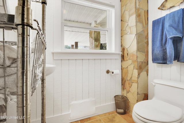 bathroom featuring tile patterned flooring and toilet