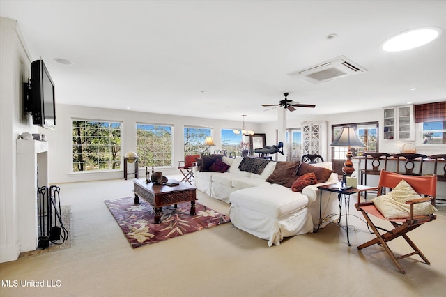 living room with ceiling fan and light colored carpet