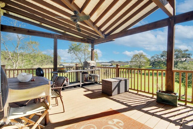 wooden terrace featuring ceiling fan