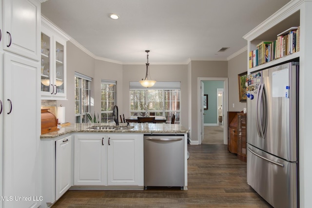 kitchen featuring white cabinets, sink, dark hardwood / wood-style floors, appliances with stainless steel finishes, and light stone counters