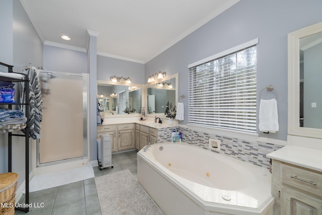 bathroom featuring tile patterned flooring, shower with separate bathtub, vanity, and crown molding