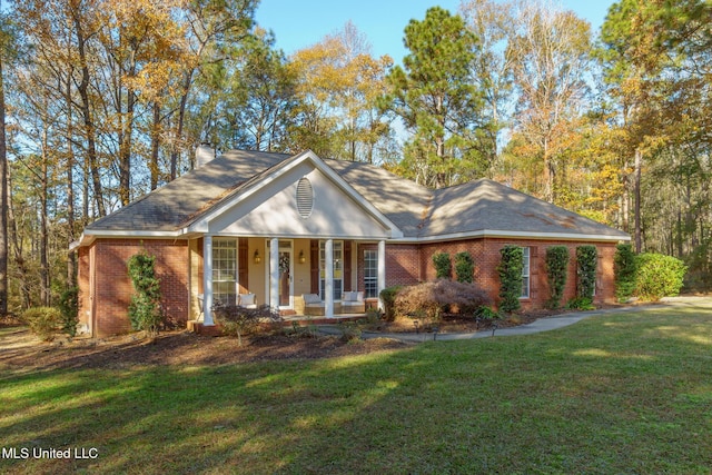 ranch-style house with a front lawn and a porch