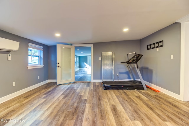 exercise area with hardwood / wood-style flooring