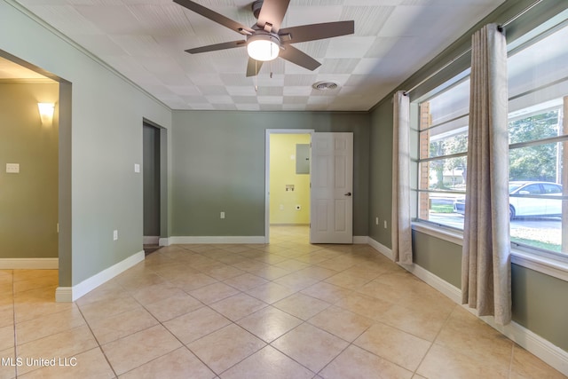 tiled empty room with ceiling fan