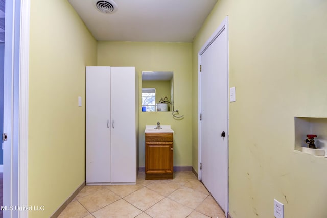 hall featuring light tile patterned floors