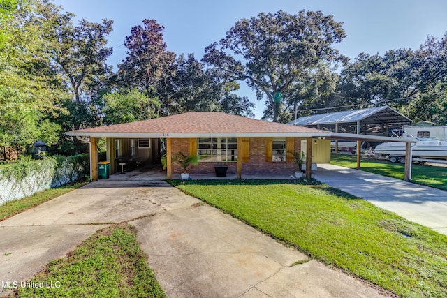 ranch-style house with a carport and a front yard