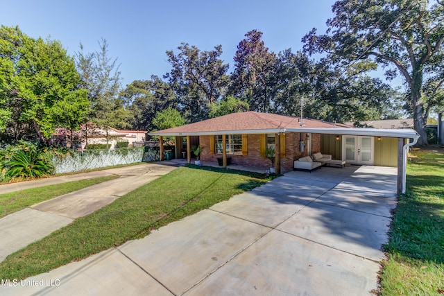 single story home with a front lawn