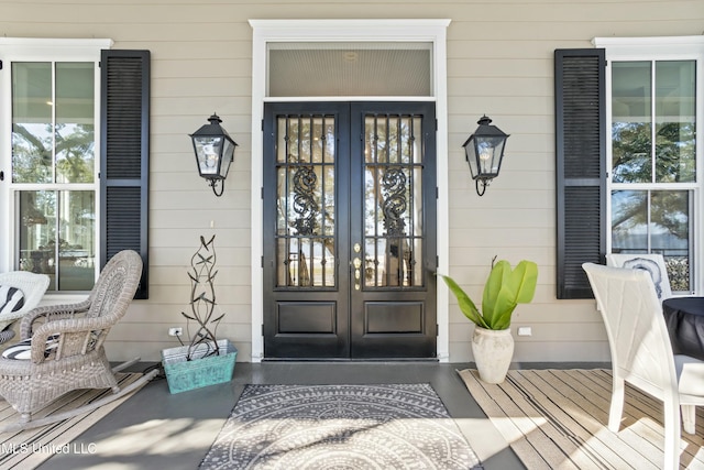 property entrance featuring french doors