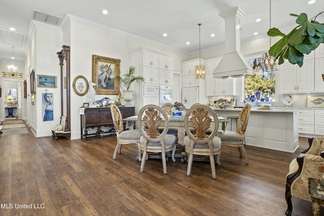 dining area featuring dark wood-type flooring, recessed lighting, visible vents, and ornamental molding