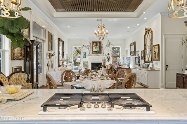 interior space featuring recessed lighting, a fireplace, visible vents, and crown molding