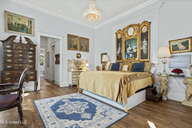 bedroom featuring an inviting chandelier, baseboards, ornamental molding, and wood finished floors