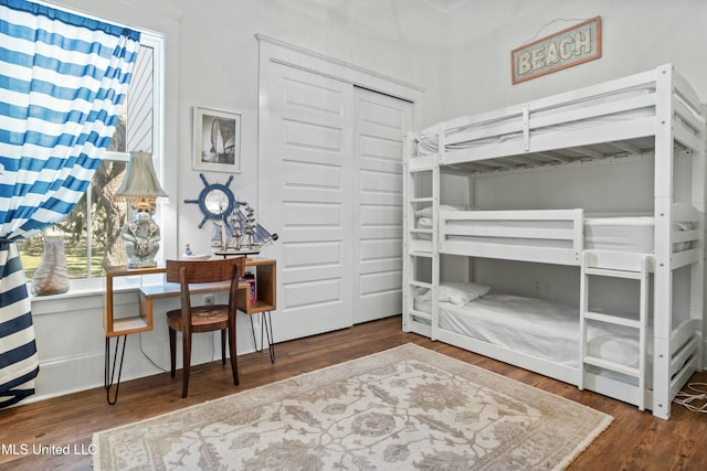 bedroom with a closet and wood finished floors