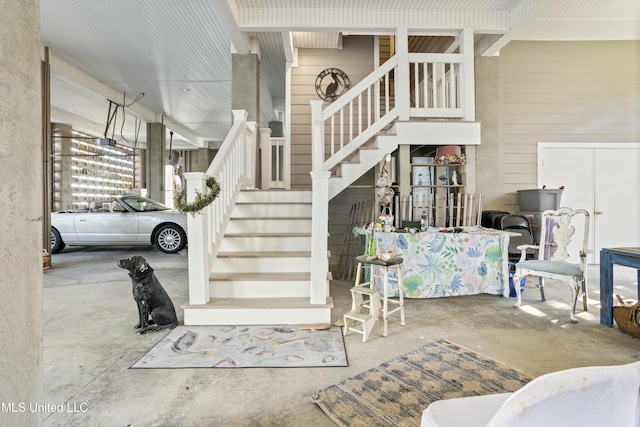 stairs with unfinished concrete floors