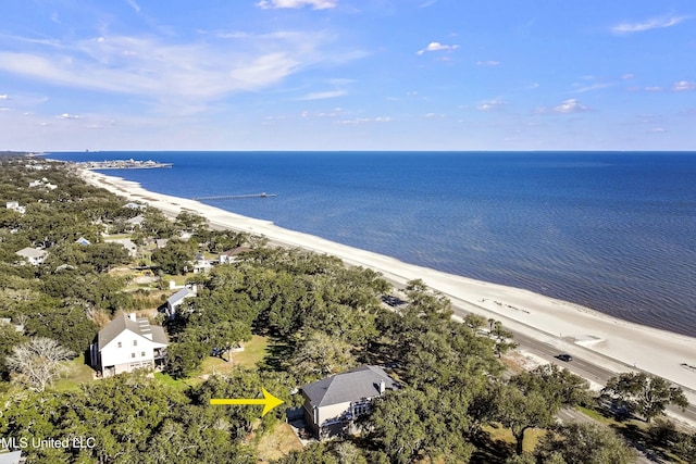 birds eye view of property featuring a water view and a beach view