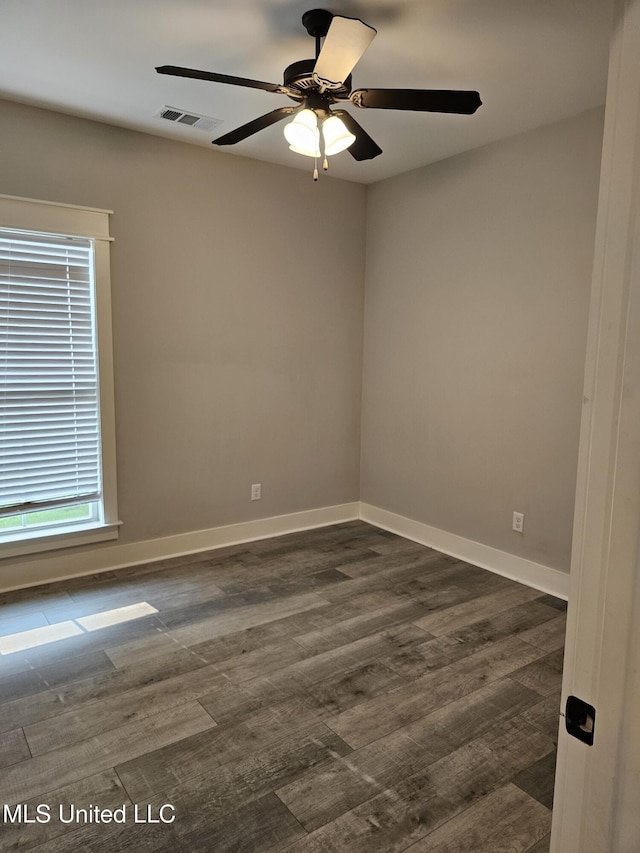 3545 Bailey Ln, Southaven, MS 38672 - empty room featuring ceiling fan, dark wood-style flooring, and baseboards