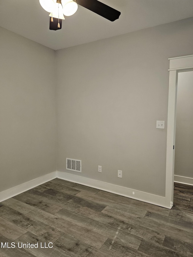 3545 Bailey Ln, Southaven, MS 38672 - empty room featuring dark wood-style floors, ceiling fan, and baseboards