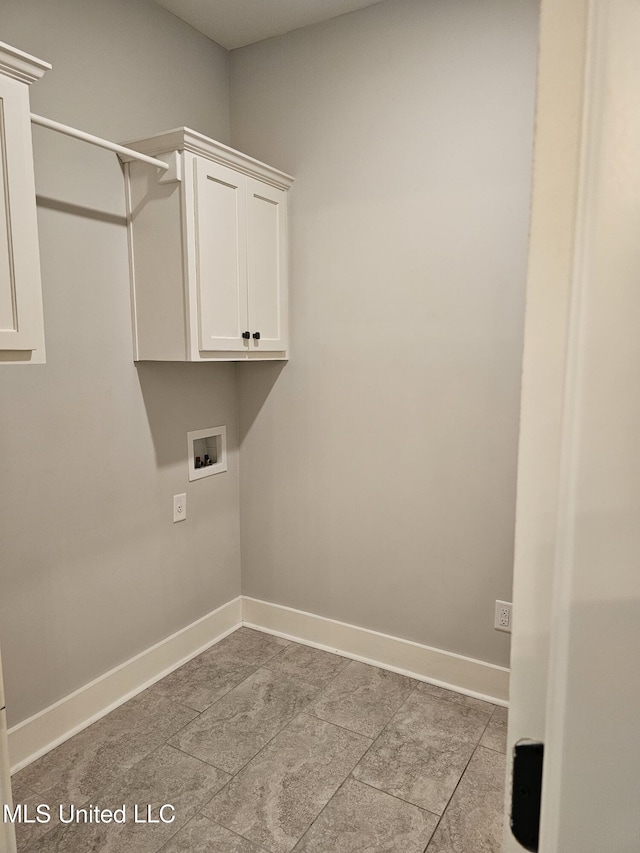 3545 Bailey Ln, Southaven, MS 38672 - laundry room featuring hookup for a washing machine, baseboards, and cabinet space