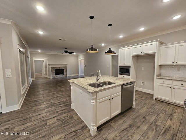3545 Bailey Ln, Southaven, MS 38672 - kitchen with a sink, stainless steel appliances, ornamental molding, a ceiling fan, and a fireplace