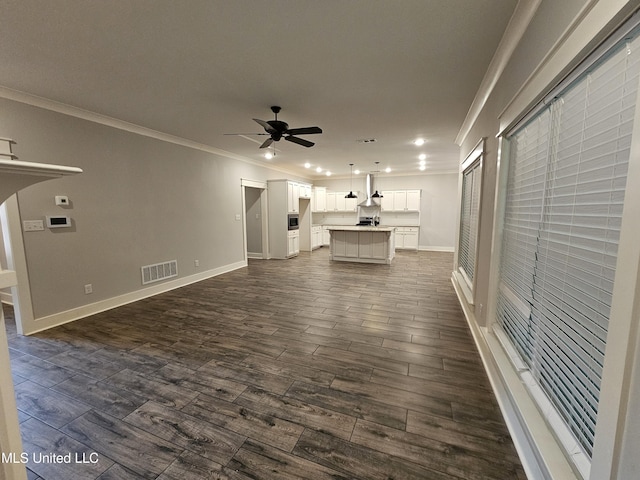 3545 Bailey Ln, Southaven, MS 38672 - unfurnished living room featuring ornamental molding, a ceiling fan, dark wood-type flooring, baseboards, and recessed lighting