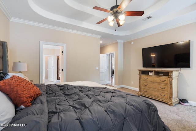 carpeted bedroom with crown molding, ceiling fan, and a raised ceiling