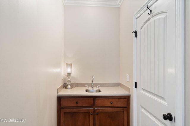 bathroom featuring vanity and crown molding