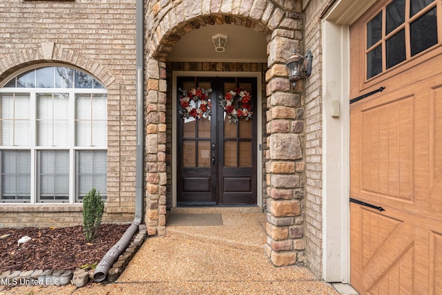 view of exterior entry featuring french doors