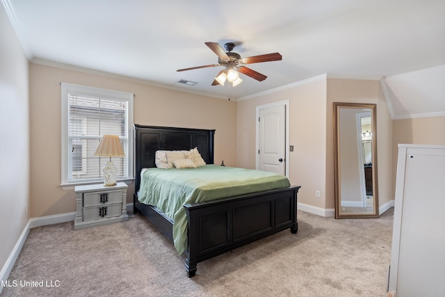 carpeted bedroom with ceiling fan and crown molding