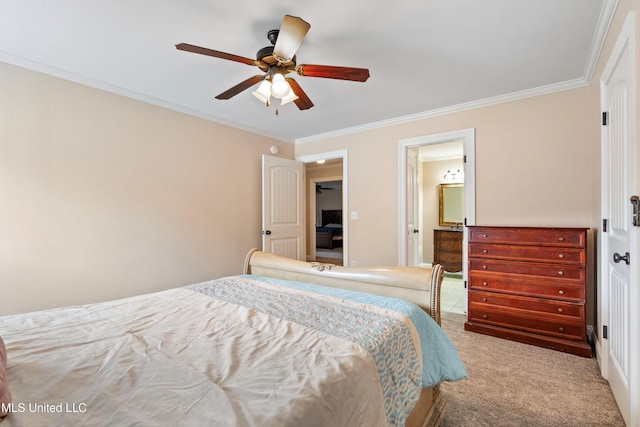 carpeted bedroom featuring ornamental molding, ensuite bathroom, and ceiling fan