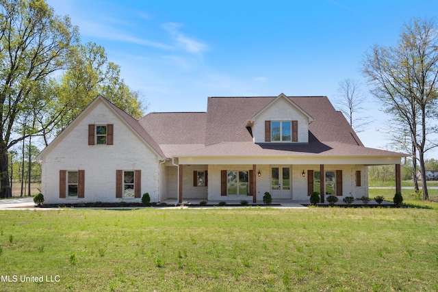 13721 Pebble Ridge Dr, Byhalia, MS 38611 - view of front of property with brick siding, a front yard, a shingled roof, and covered porch