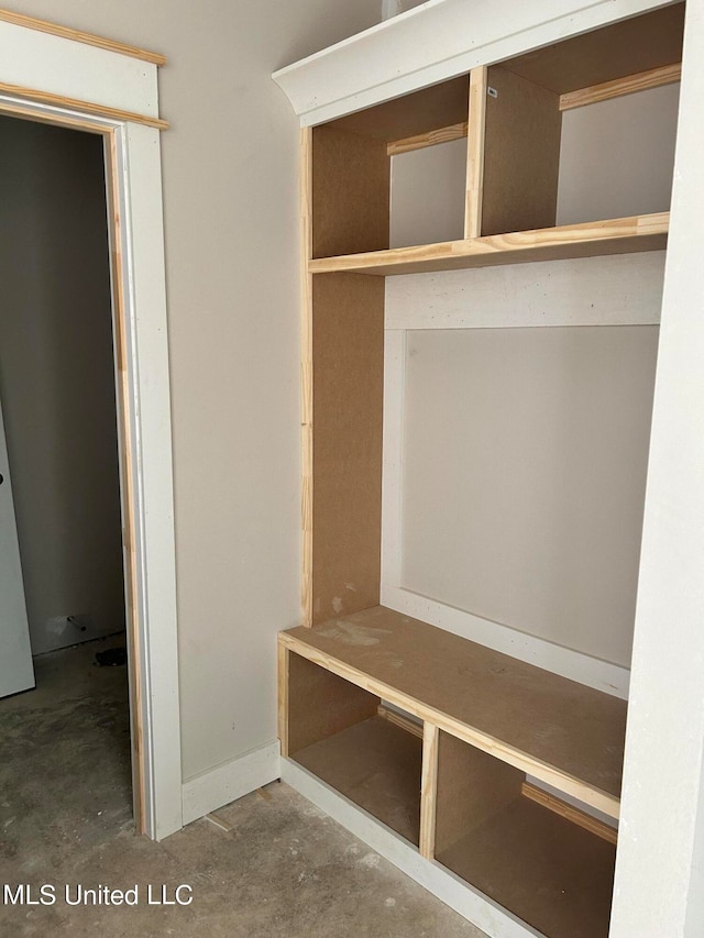 mudroom with concrete flooring