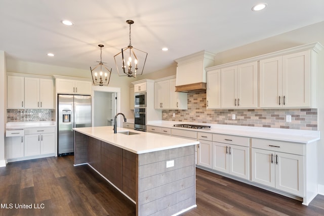 13721 Pebble Ridge Dr, Byhalia, MS 38611 - kitchen with appliances with stainless steel finishes, a sink, a chandelier, backsplash, and light countertops