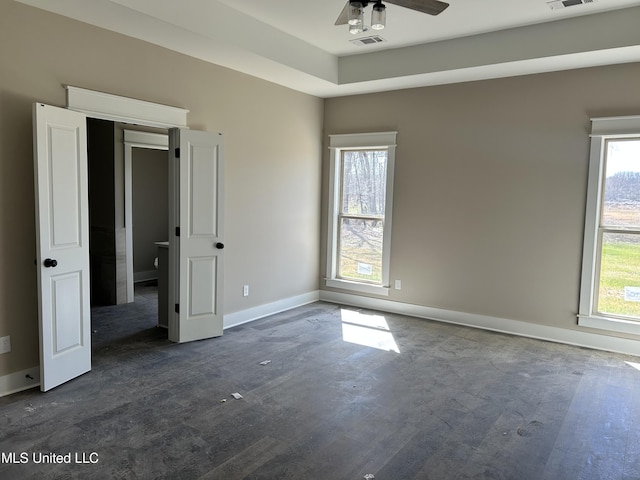 unfurnished bedroom with visible vents and baseboards