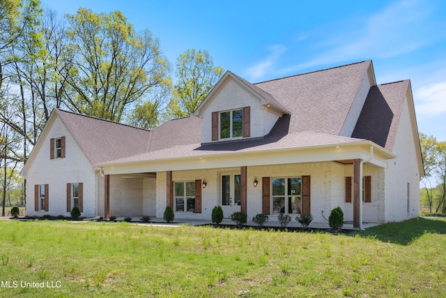 13721 Pebble Ridge Dr, Byhalia, MS 38611 - view of front of house with brick siding, a shingled roof, a front lawn, french doors, and covered porch