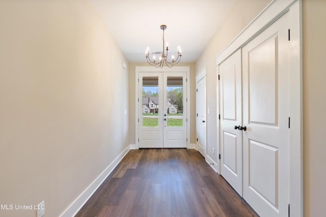 13721 Pebble Ridge Dr, Byhalia, MS 38611 - entryway with a chandelier, dark wood-style flooring, and baseboards
