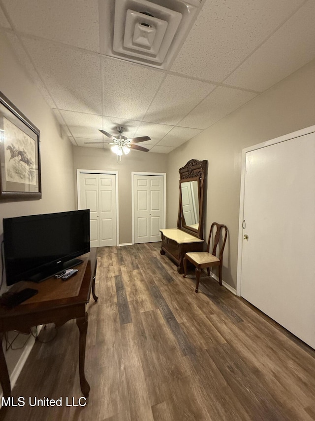 518 Main St, Natchez, MS 39120 - sitting room featuring a paneled ceiling, wood finished floors, ceiling fan, and baseboards