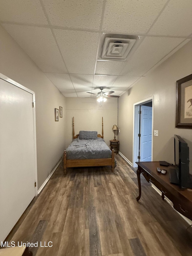 518 Main St, Natchez, MS 39120 - bedroom with a drop ceiling, wood finished floors, and baseboards