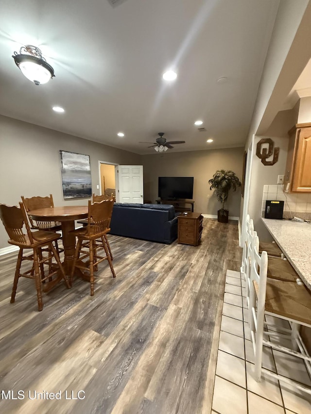 518 Main St, Natchez, MS 39120 - dining room with a ceiling fan, light wood-style floors, baseboards, and recessed lighting