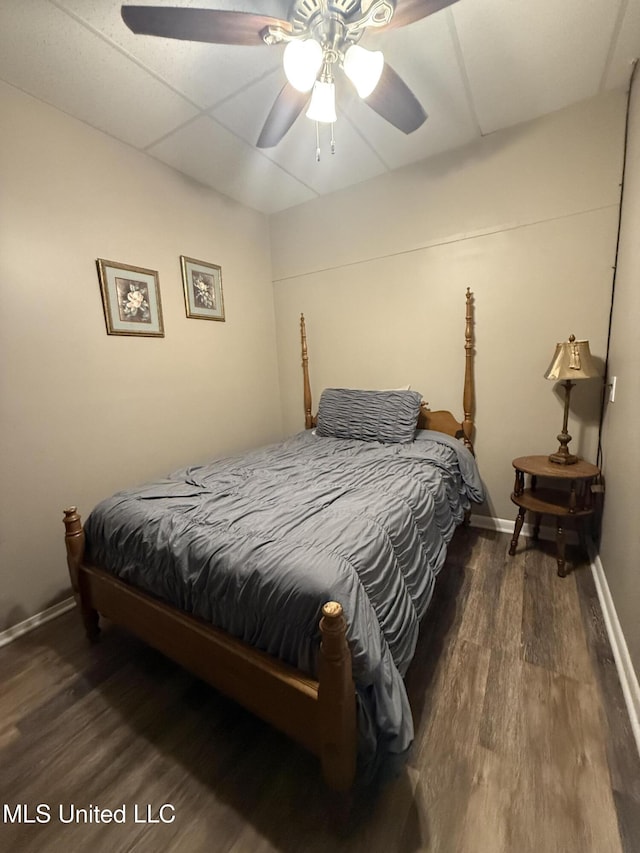 518 Main St, Natchez, MS 39120 - bedroom with wood finished floors, baseboards, and ceiling fan