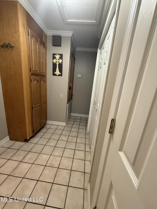 518 Main St, Natchez, MS 39120 - hallway with attic access, baseboards, light tile patterned flooring, and ornamental molding
