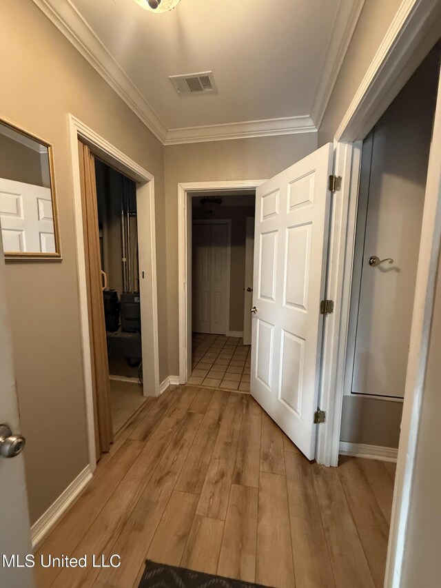 518 Main St, Natchez, MS 39120 - hallway featuring light wood-style floors, ornamental molding, and baseboards
