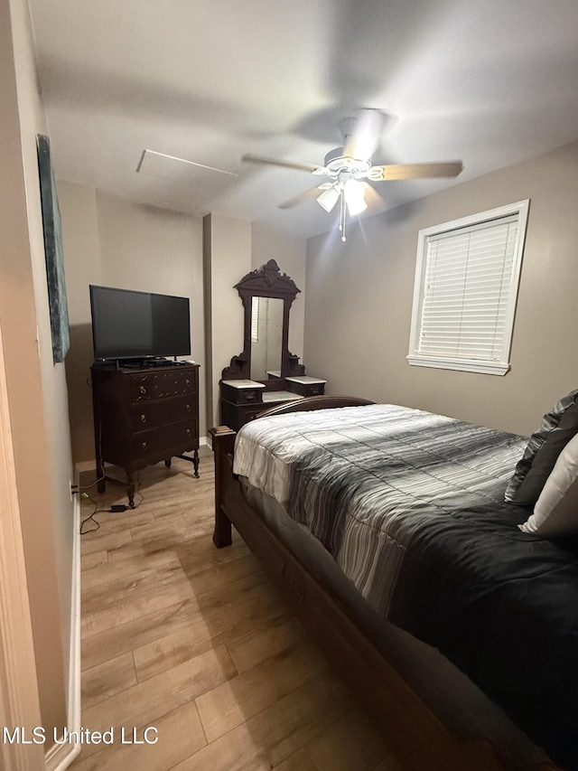 518 Main St, Natchez, MS 39120 - bedroom featuring light wood-type flooring and a ceiling fan