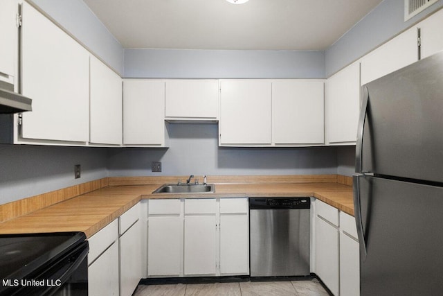 5155 Wayneland Dr Unit F6, Jackson, MS 39211 - kitchen with stainless steel appliances, a sink, white cabinetry, and light countertops