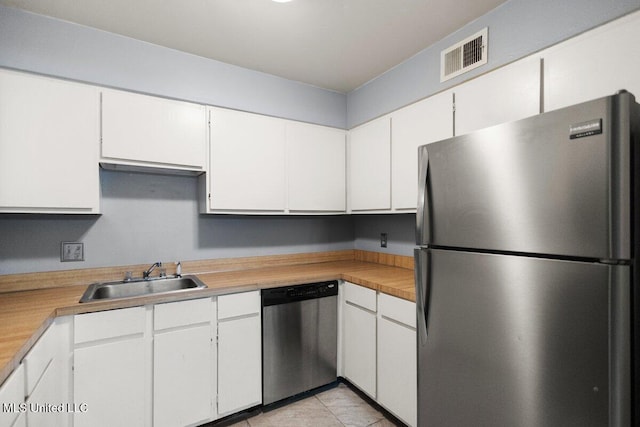 5155 Wayneland Dr Unit F6, Jackson, MS 39211 - kitchen featuring stainless steel appliances, a sink, white cabinetry, and light countertops